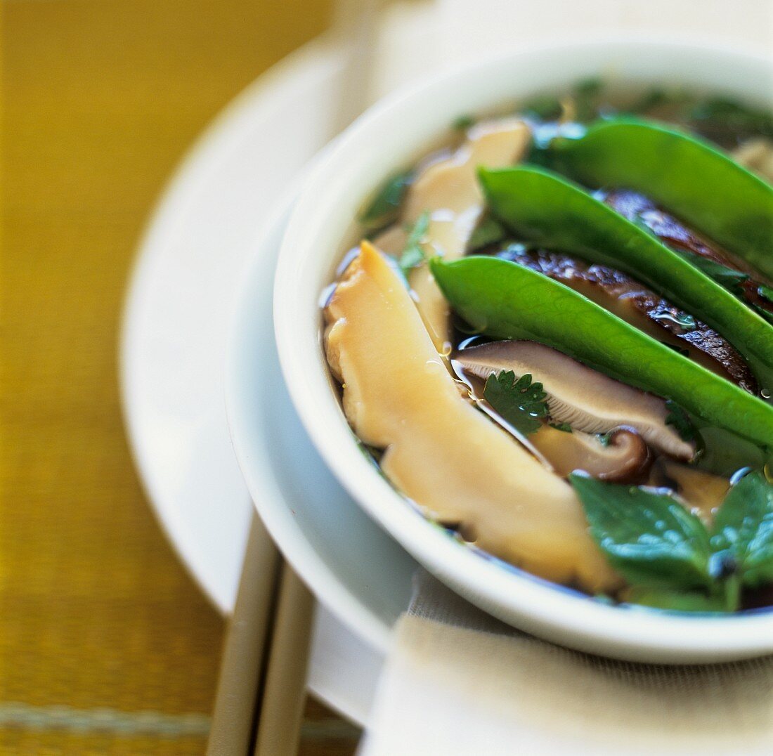 Abalone soup made with dried mushrooms and mange tout (China)