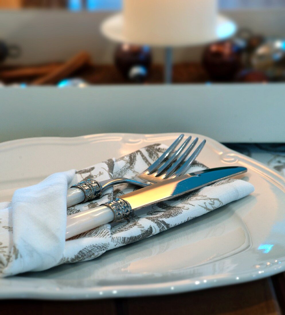 Cutlery and a napkin on a plate for Christmas dinner