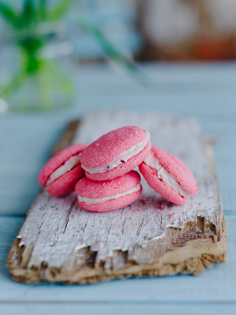 Pink macaroons on a wooden board