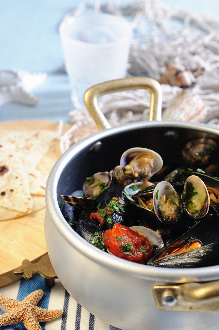 Mussel and clam antipasto with cherry tomatoes and white wine