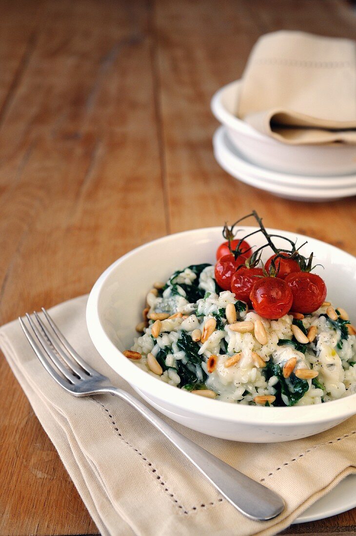 Spinach, gorgonzola and pine nut risotto topped with oven roasted cherry tomatoes
