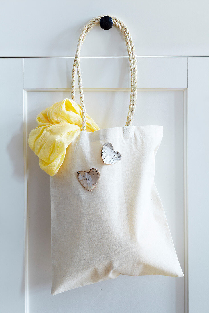 Bag with cord handles and decorative hearts