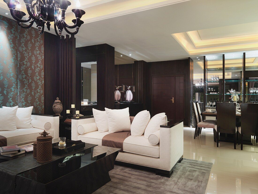 Sofa set with light upholstery in front of dining area with indirect ceiling lighting in classic, modern interior