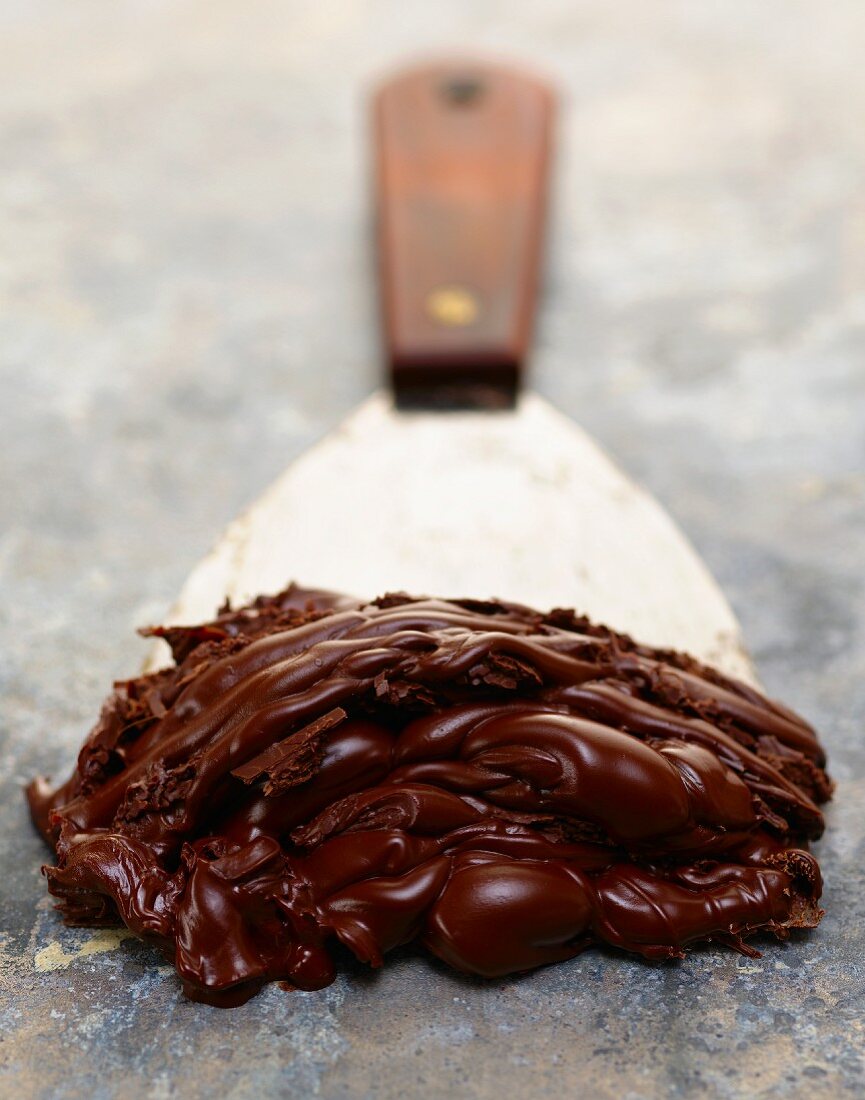 Chocolate Frosting on a Wide Metal Spatula