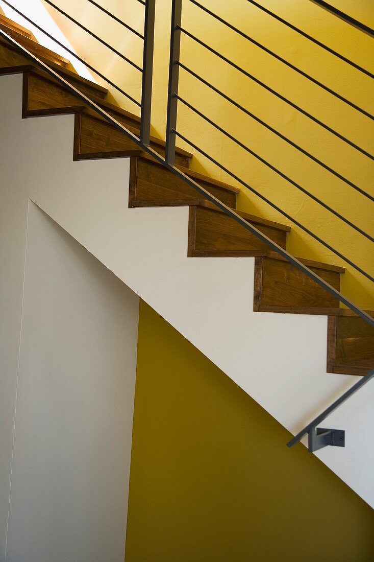 Detail of Modern Hardwood Stairwell and Yellow Wall