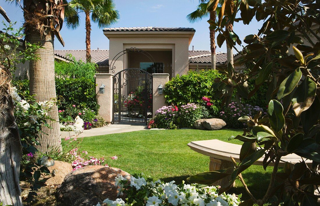 Stone Bench in Yard with Garden