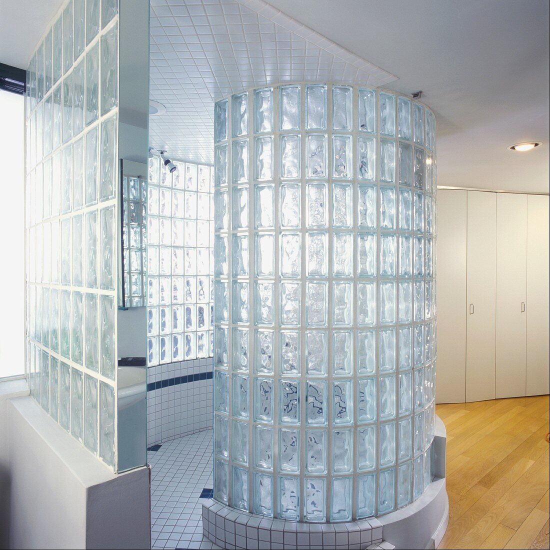 Glass brick cylinder in modern bathroom