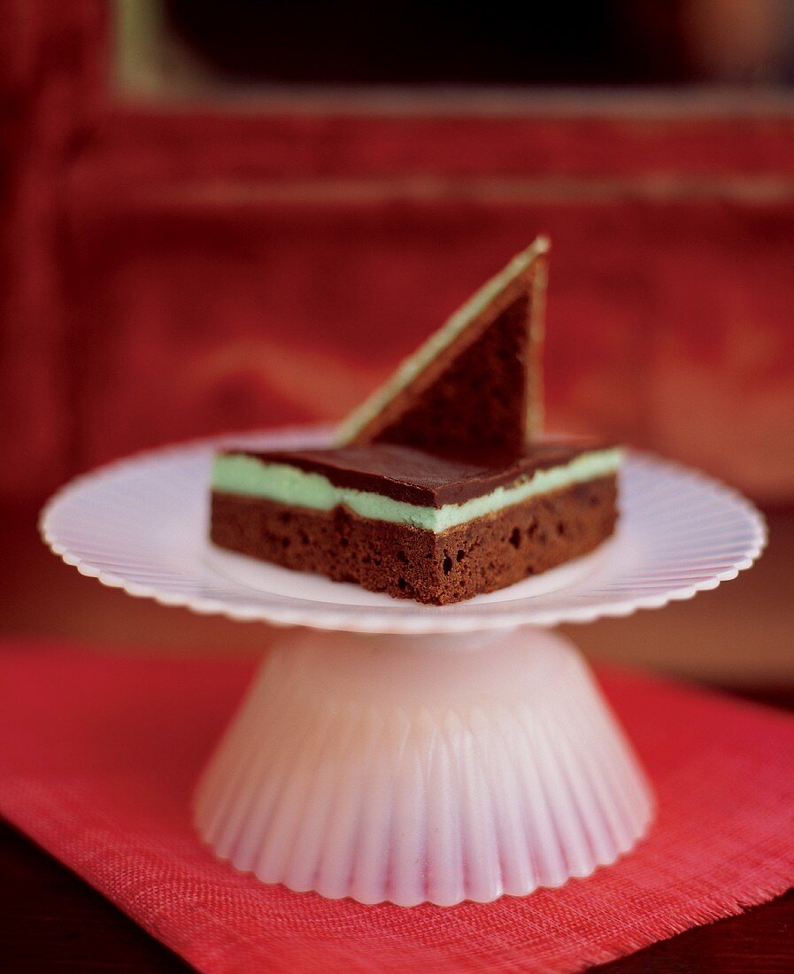 A Chocolate Mint Bar on a Small White Pedestal Dish