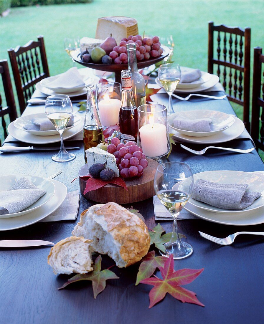 Table laid in garden with autumn theme