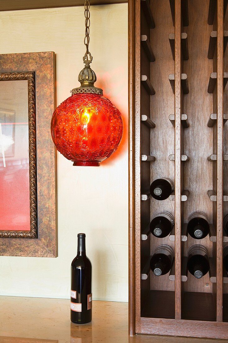 Mostly empty wine rack on a small bar