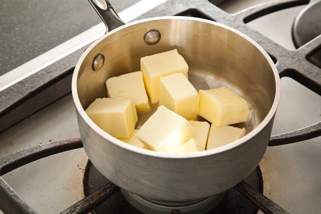 Cubes of Butter in a Pot on the Stove for Melting