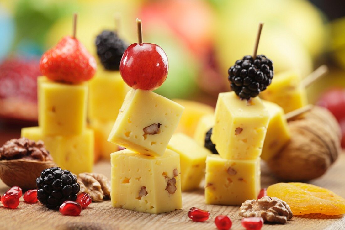 Cheese on sticks with fruit and nuts
