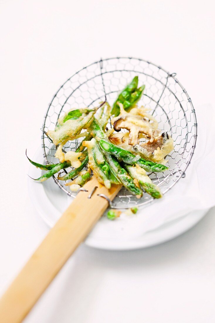 Tempura in a draining spoon