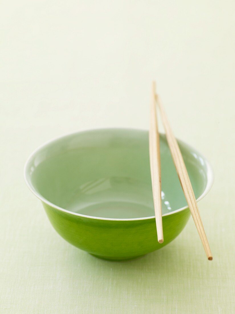 Empty Green Bowl with Chopsticks