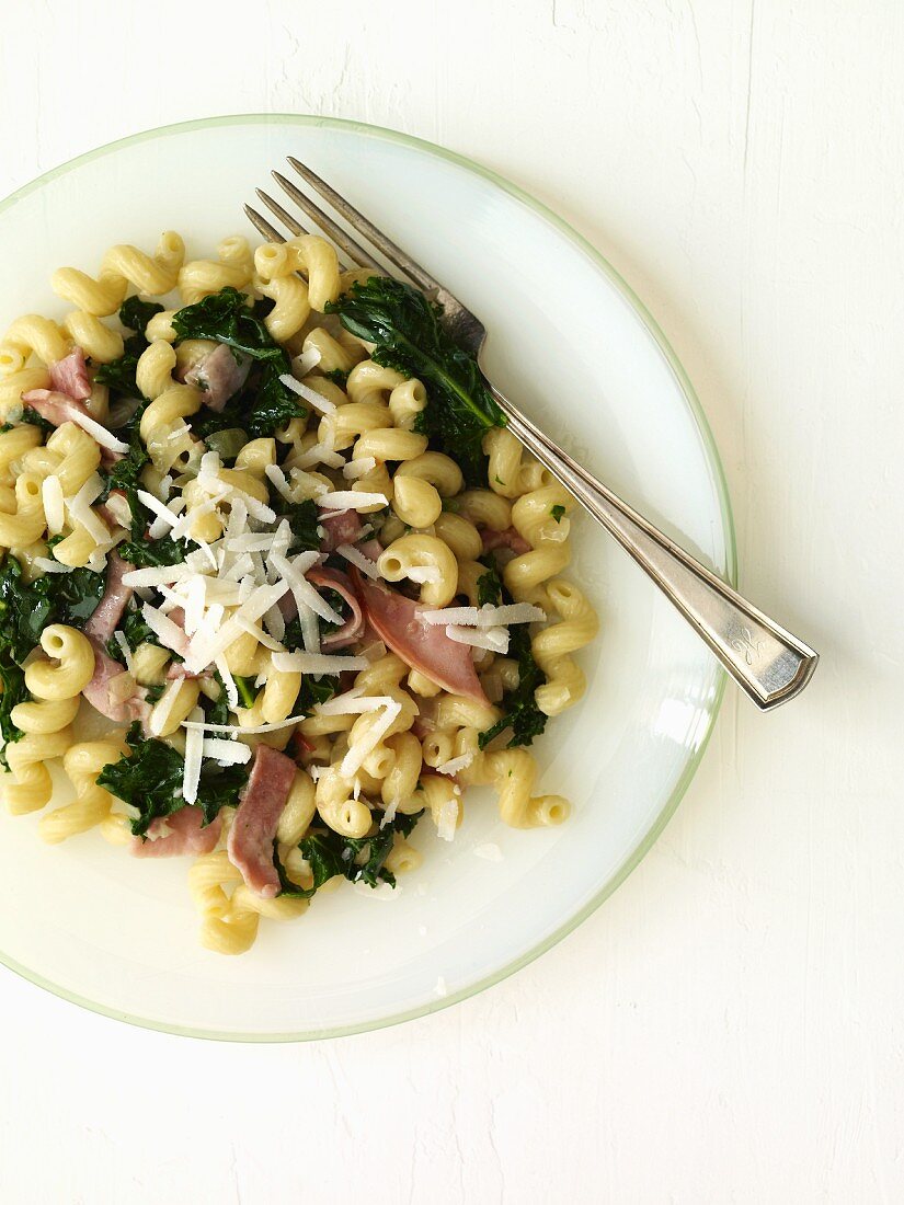 Corkscrew Pasta with Ham and Spinach on a Plate; From Above