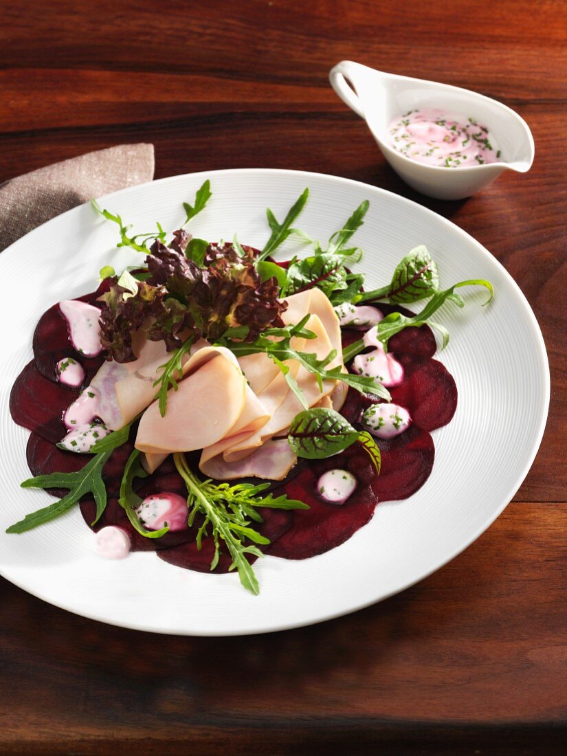 Beetroot carpaccio with ham and herb sauce
