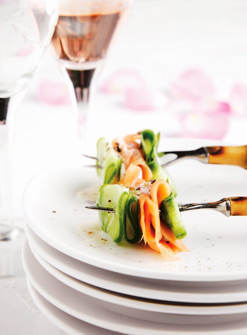 Smoked salmon and cucumber, skewered on forks