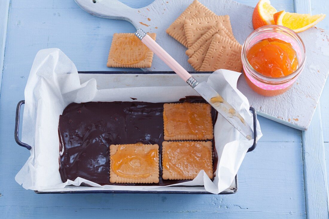 Chocolate terrine with butter biscuits being made