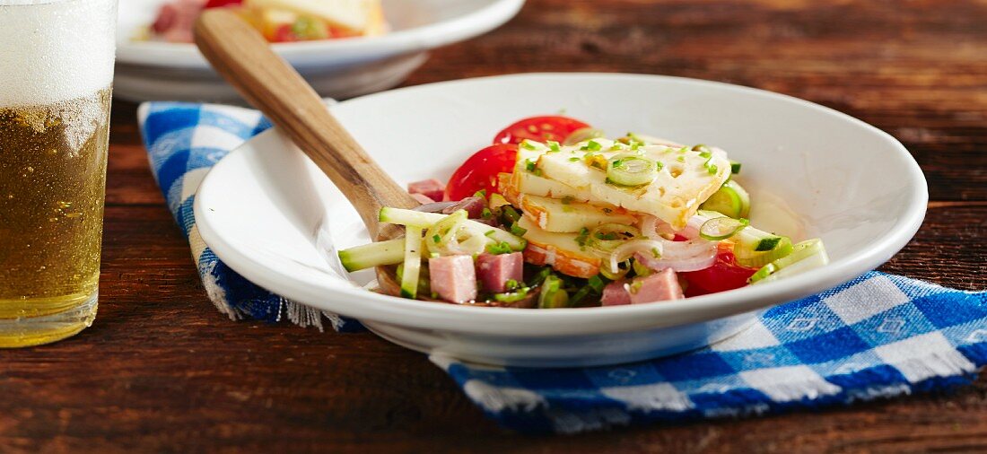 Wine cheese salad with ham and tomatoes