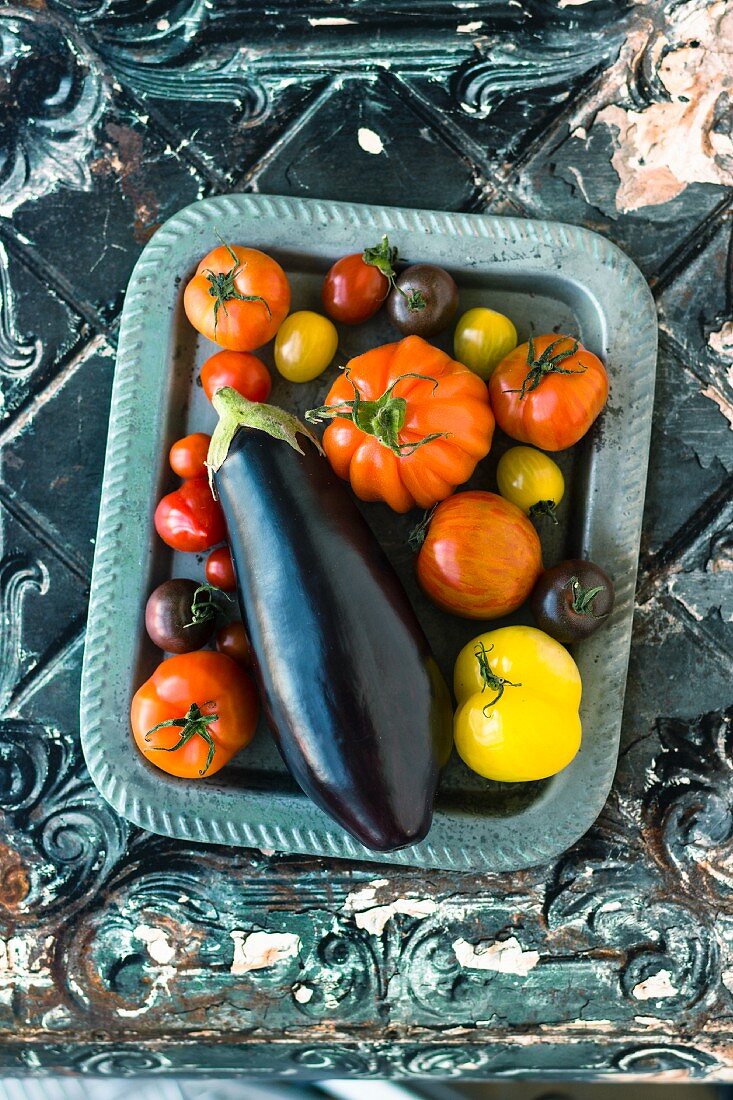 Aubergines and various different coloured tomatoes