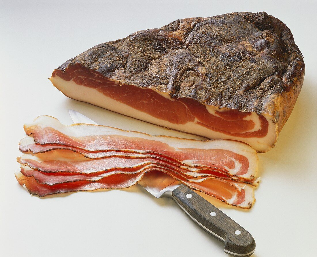 Partially Sliced Bacon; Knife