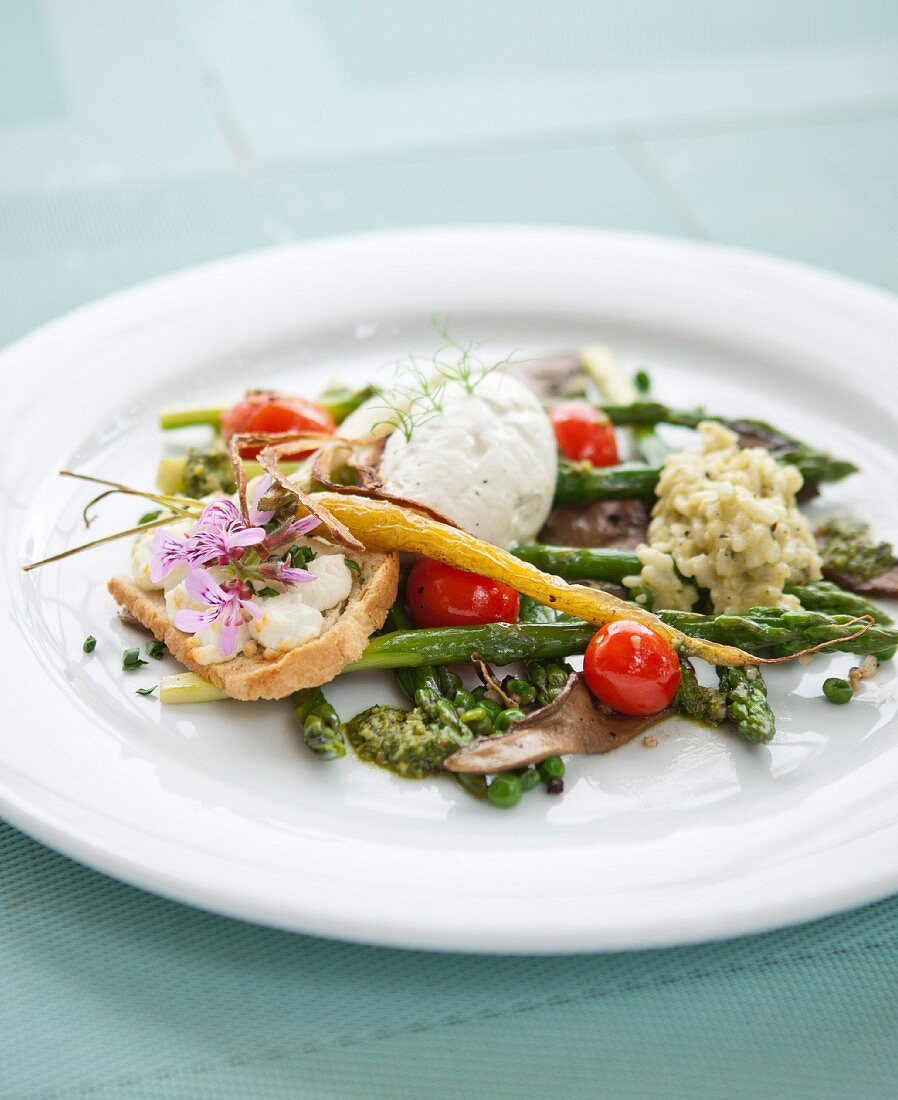 Green asparagus with a sage, stinging nettle and garlic pesto, risotto and cream cheese