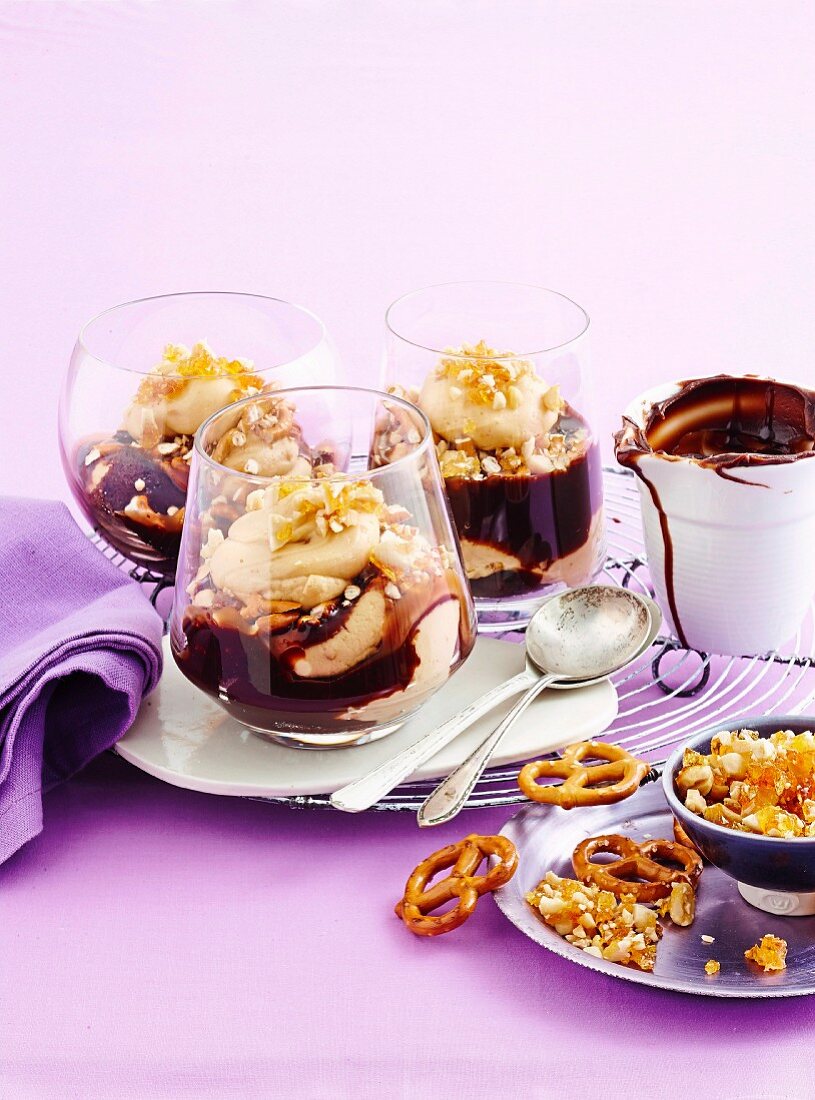 Trifle with salty peanut butter, chocolate sauce and salted pretzels