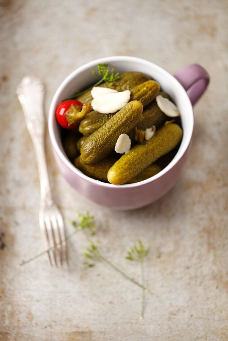 Pickled cucumbers with cherry peppers and garlic