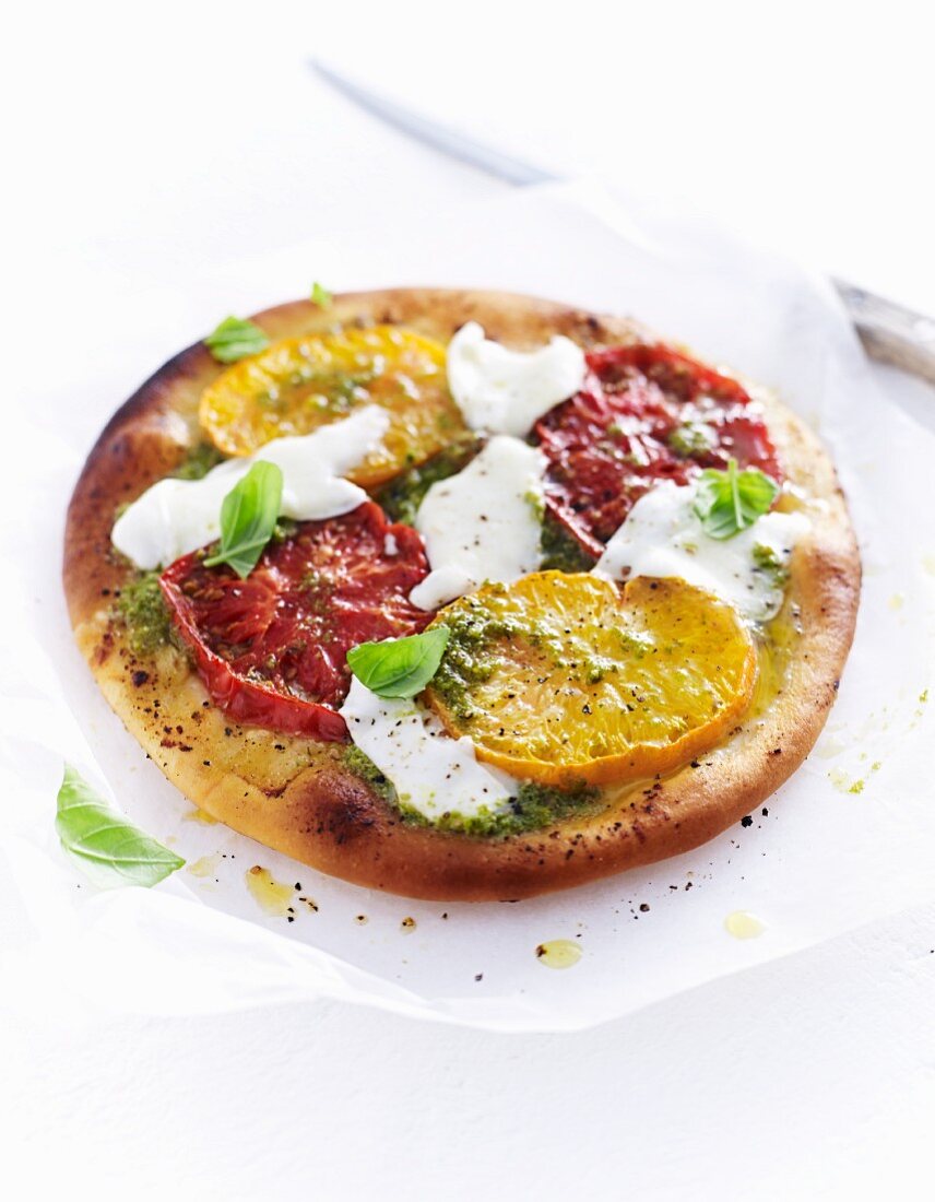 Pizza with mozzarella and beefsteak tomatoes