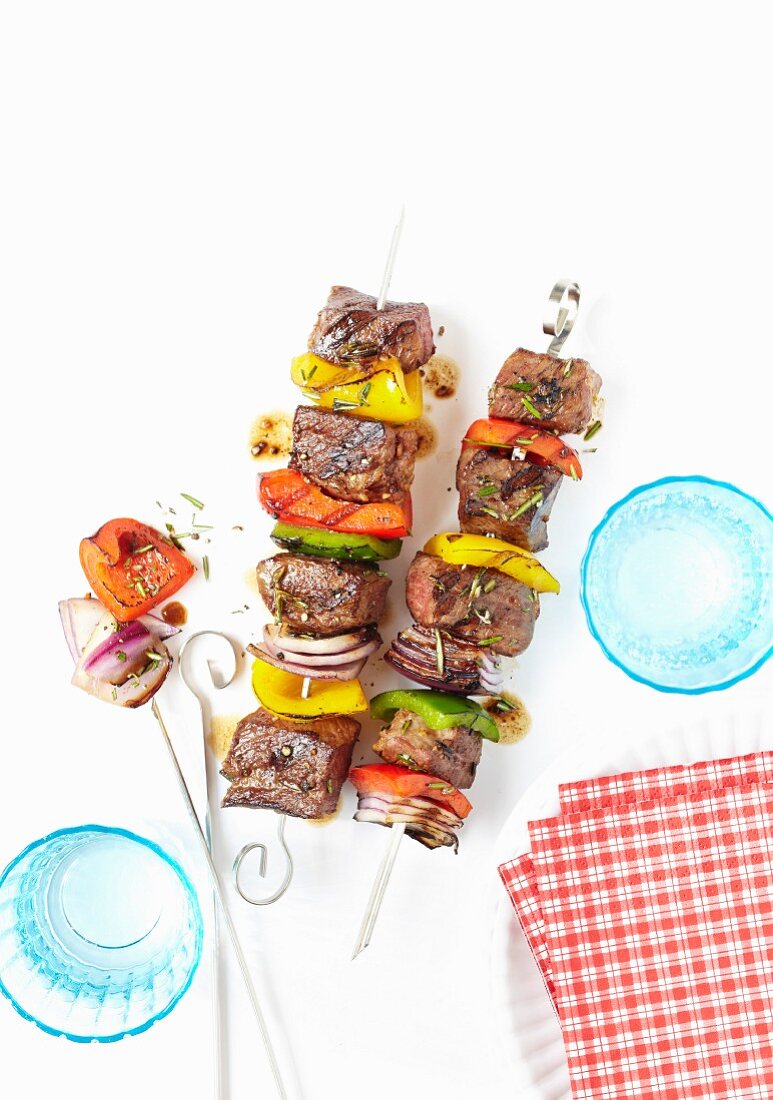 Grilled beef skewers with peppers and onions