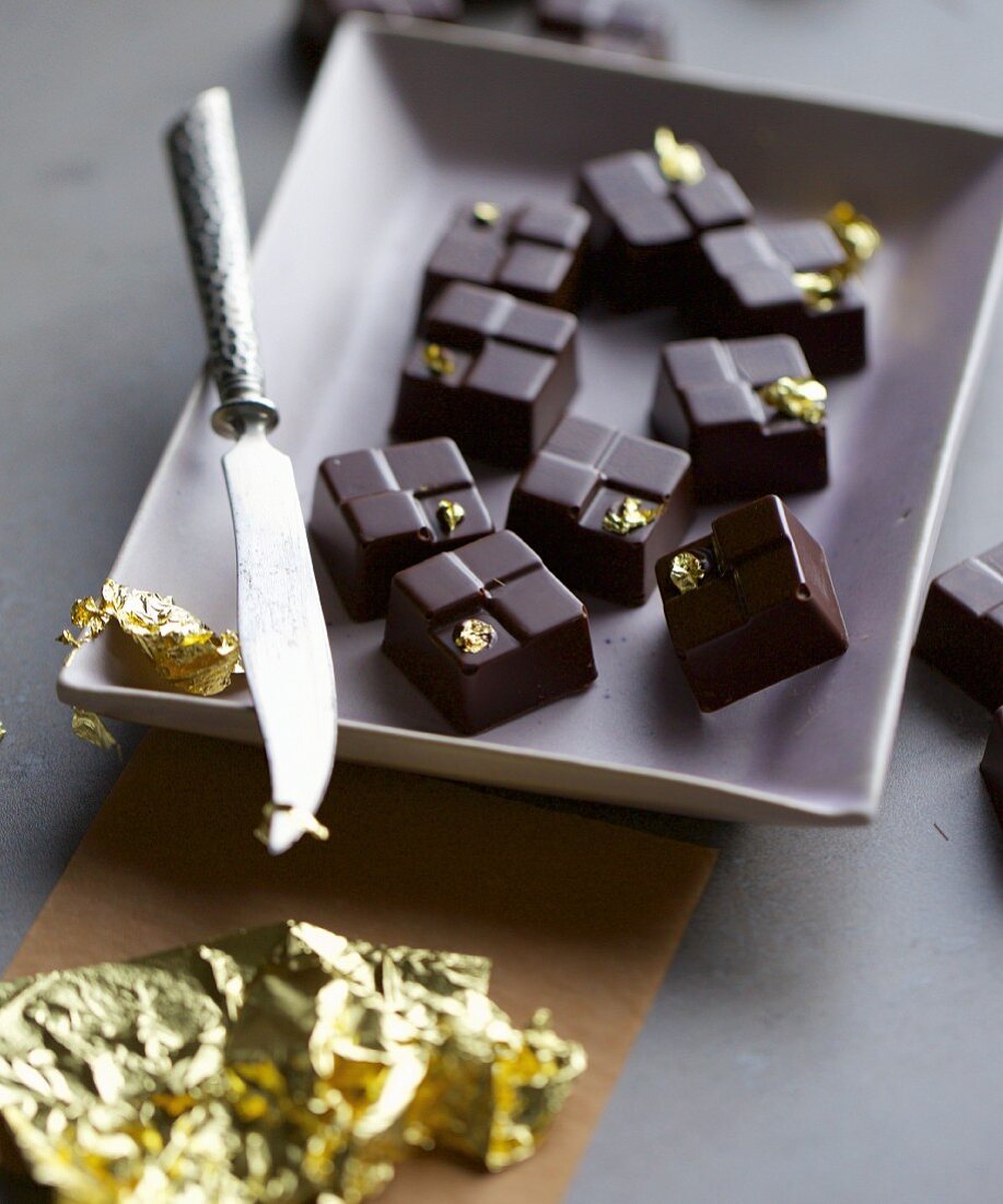 Honey and poppyseed pralines with gold leaf