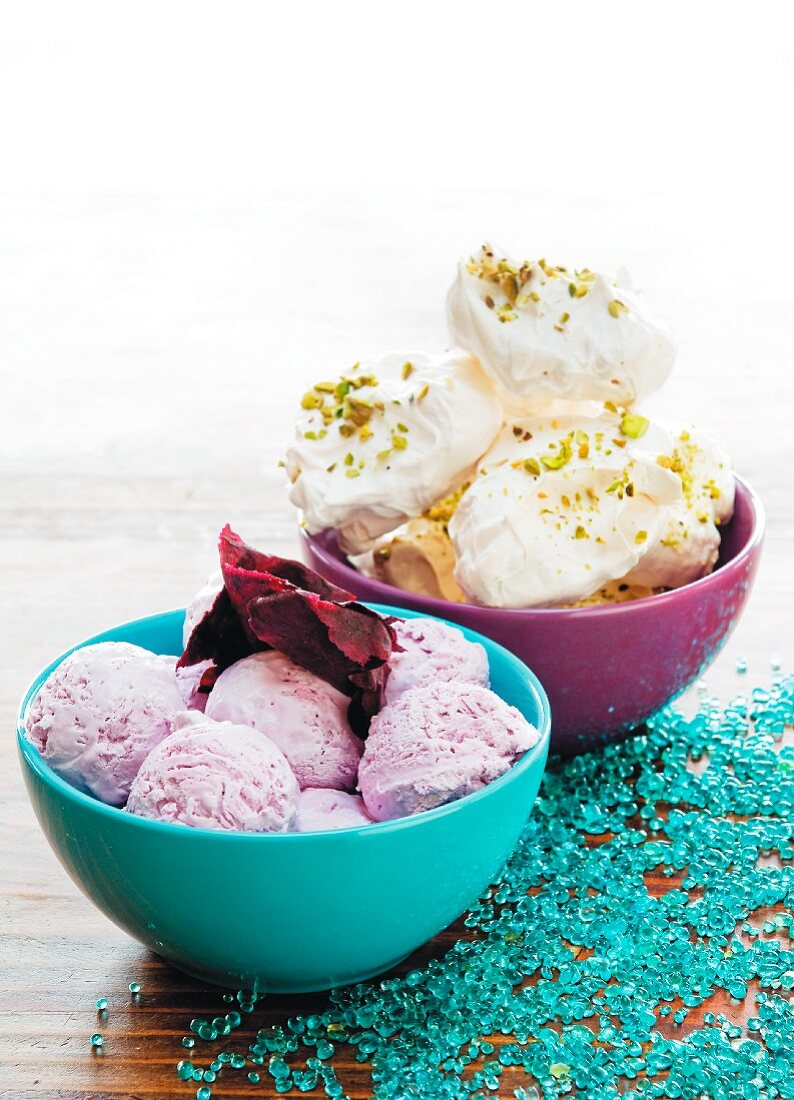 Rose ice cream and meringue with pistachios