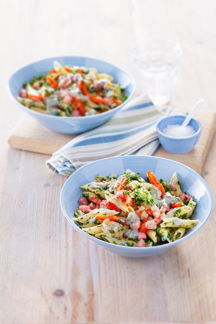 Penne pasta with kale, bacon, pepper and gorgonzola sauce