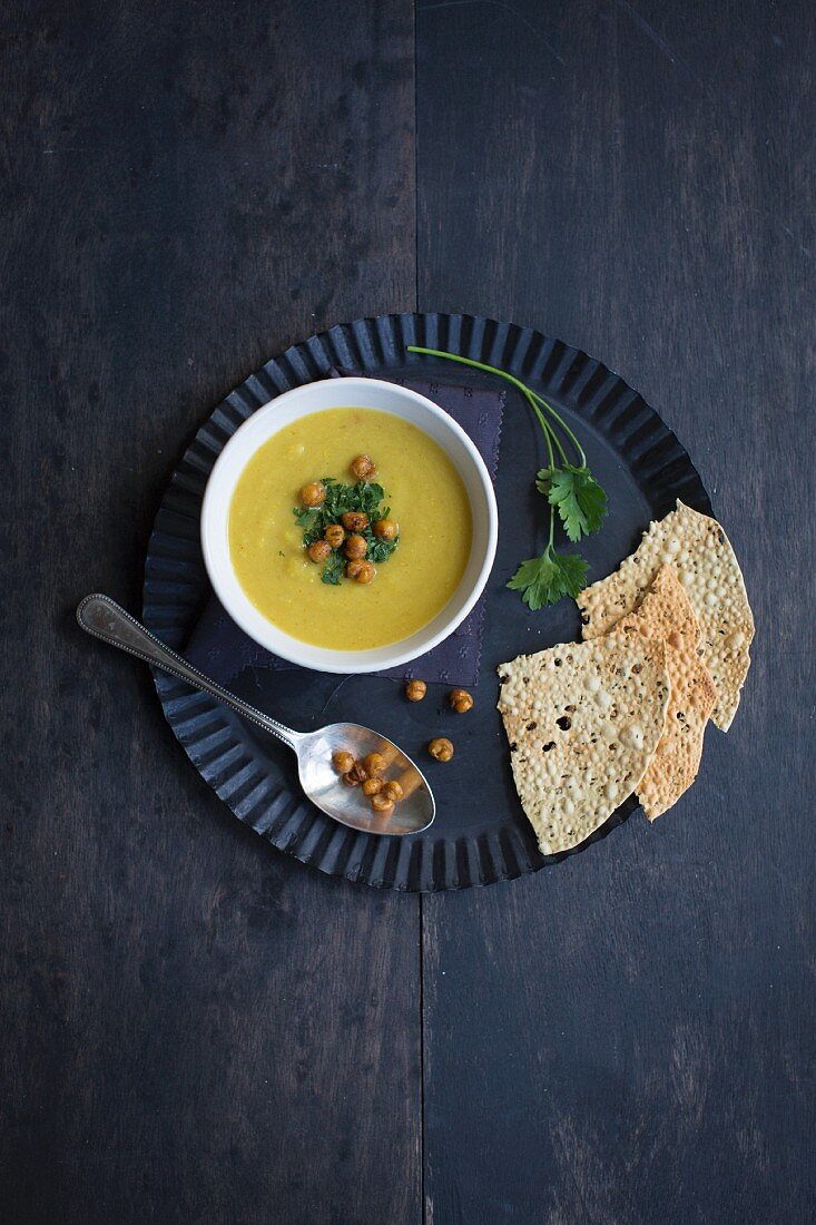 Cream of parsnip soup with curry, coriander and fried chickpeas
