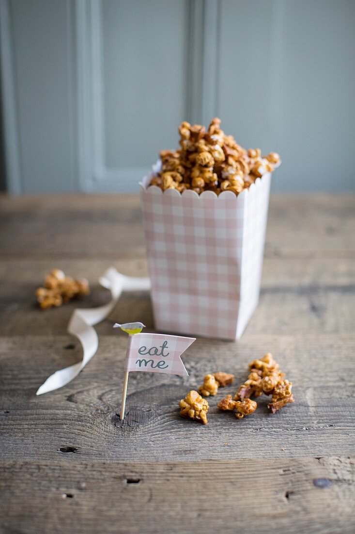 Homemade caramel popcorn with dried apple pieces