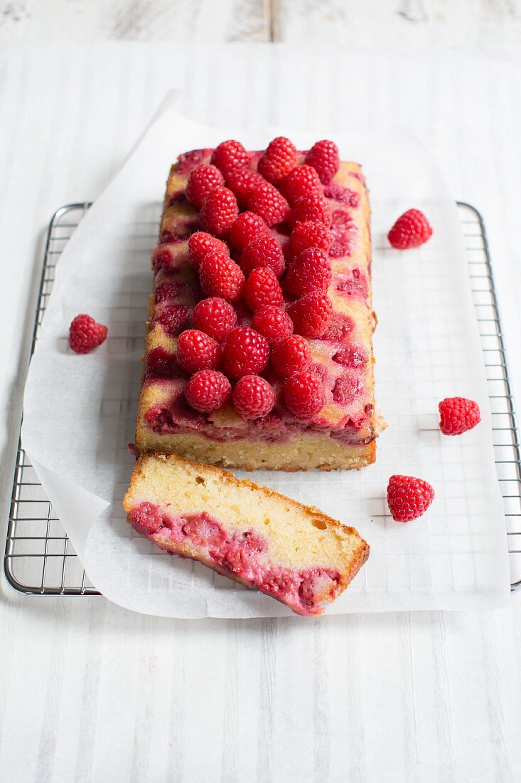 Lemon cake and raspberries, sliced
