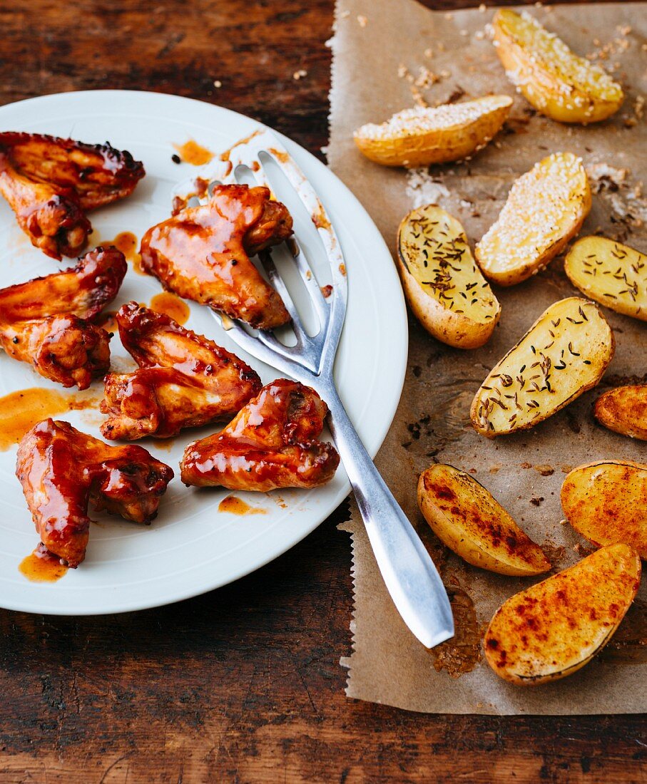 Marinated chicken wings with roasted caraway potatoes
