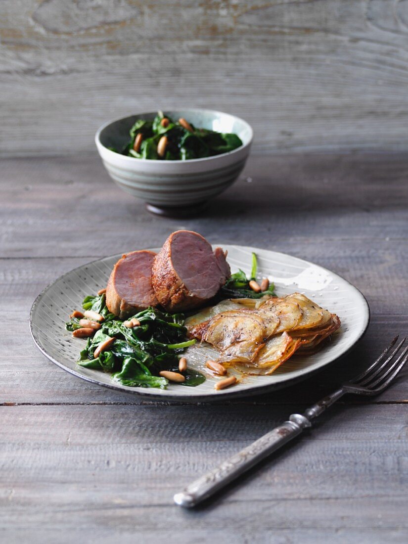 Pork tenderloin with gratinated potatoes and spinach
