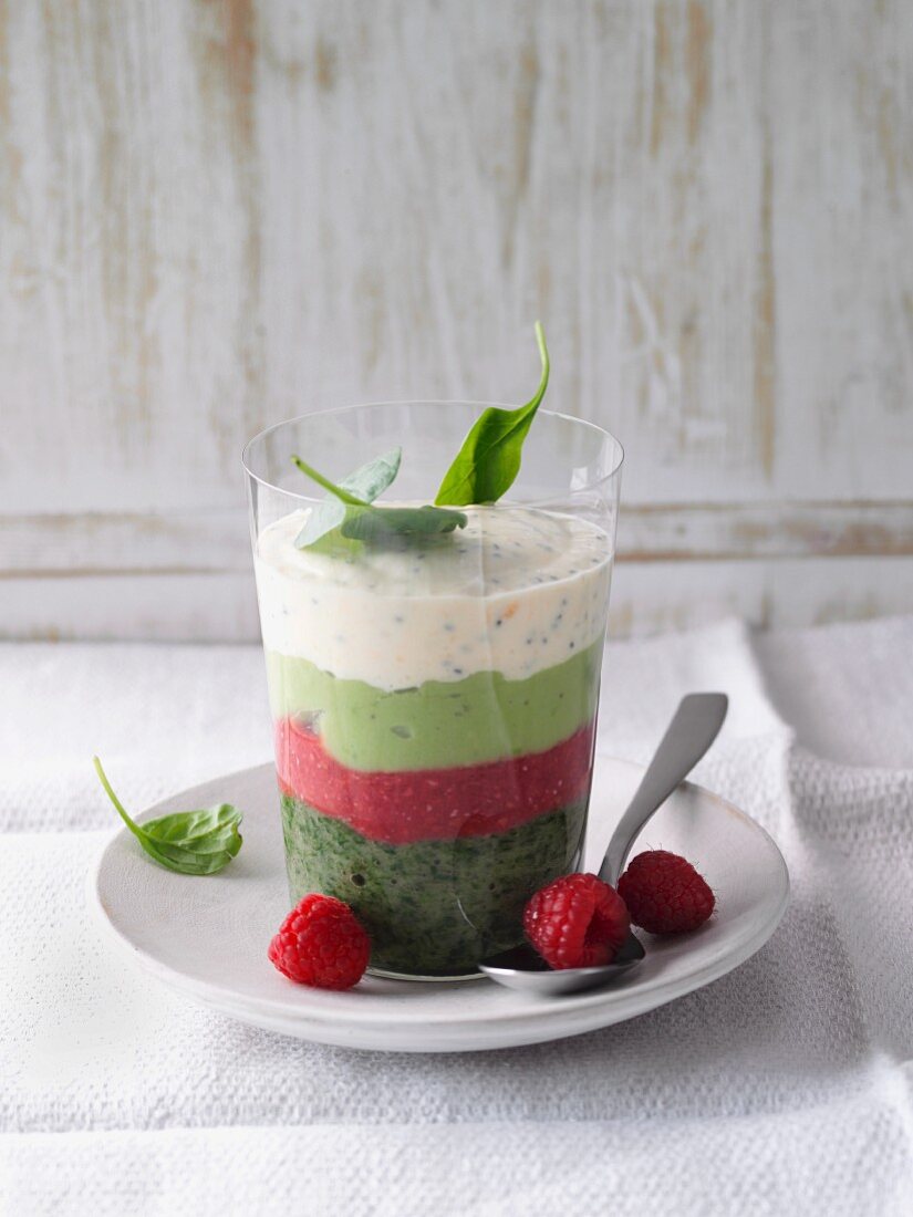Layered yoghurts made from spinach, raspberry and avocado