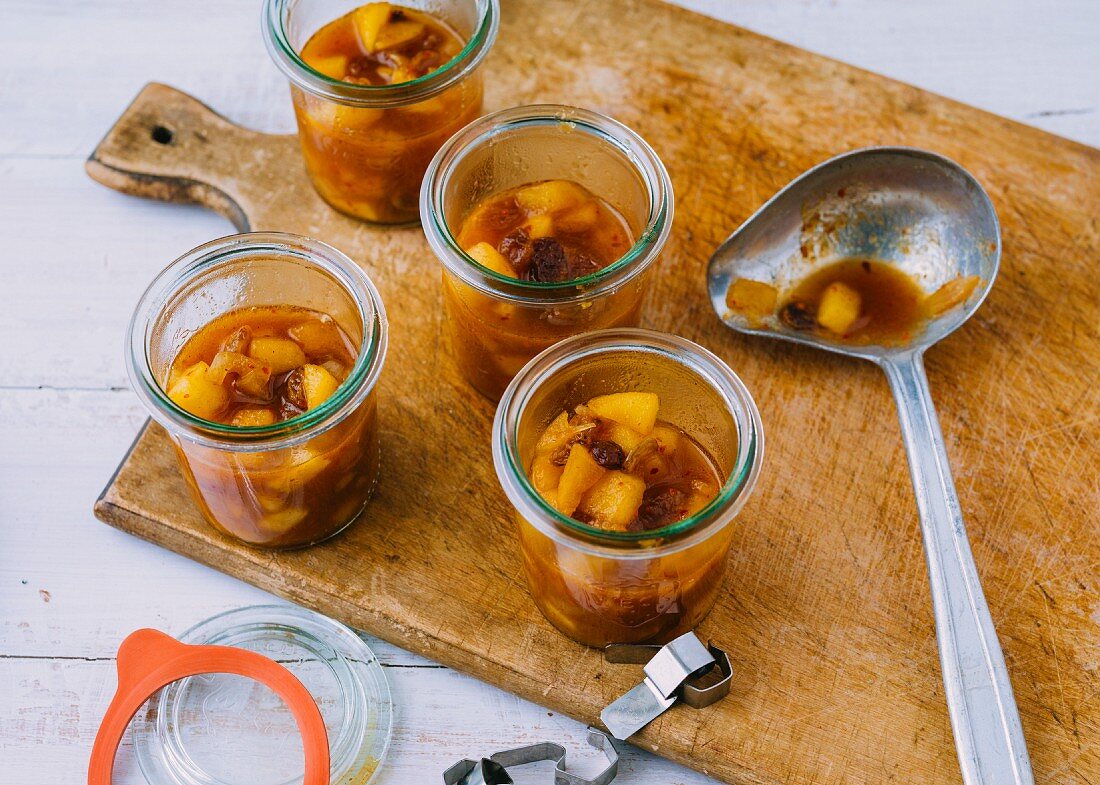 Homemade apple chutney with raisins in jars