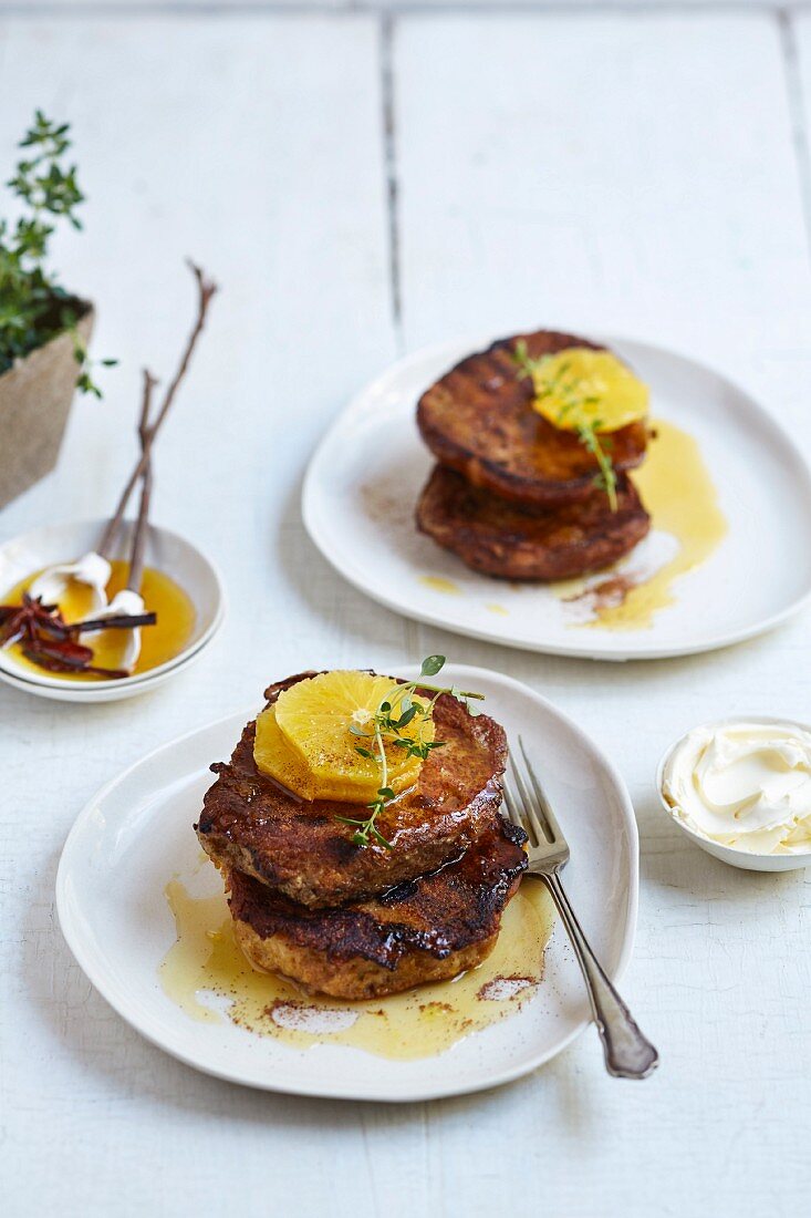 Hot cross bun French toast with orange slices and orange syrup