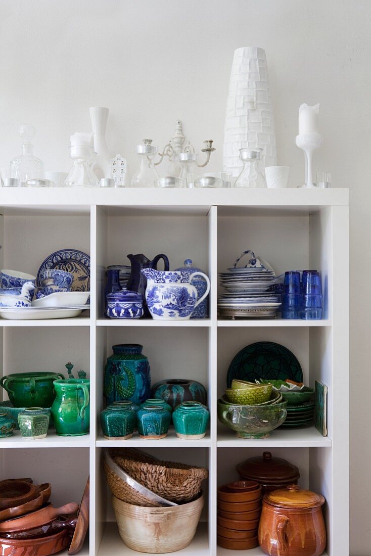 Crockery and china painted blue and white on white shelves