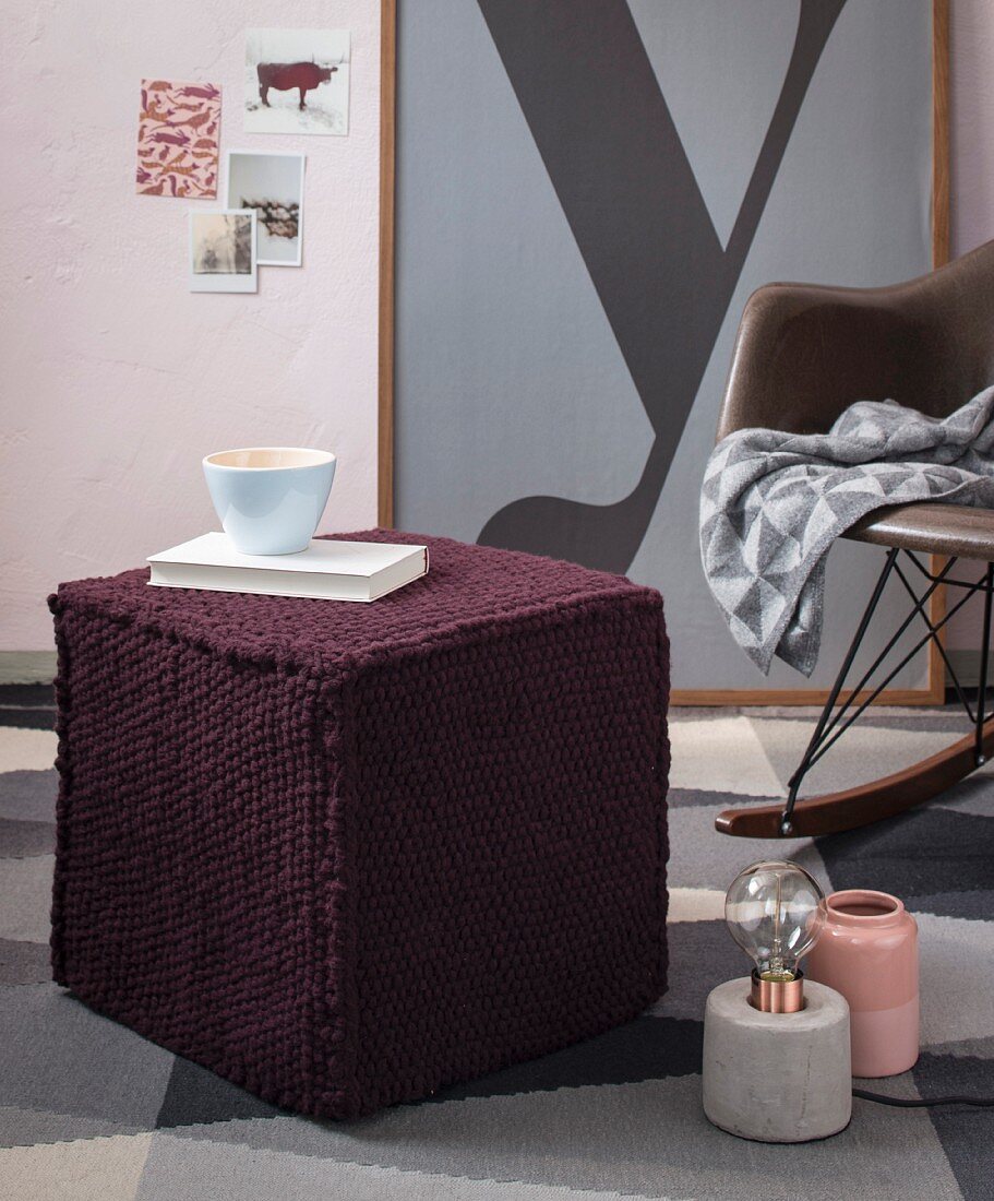 A knitted stool made from a mixed woollen yarn