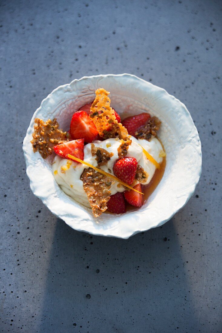 Strawberries marinated in rose water with Cassata cream and pistachio and sesame not brittle