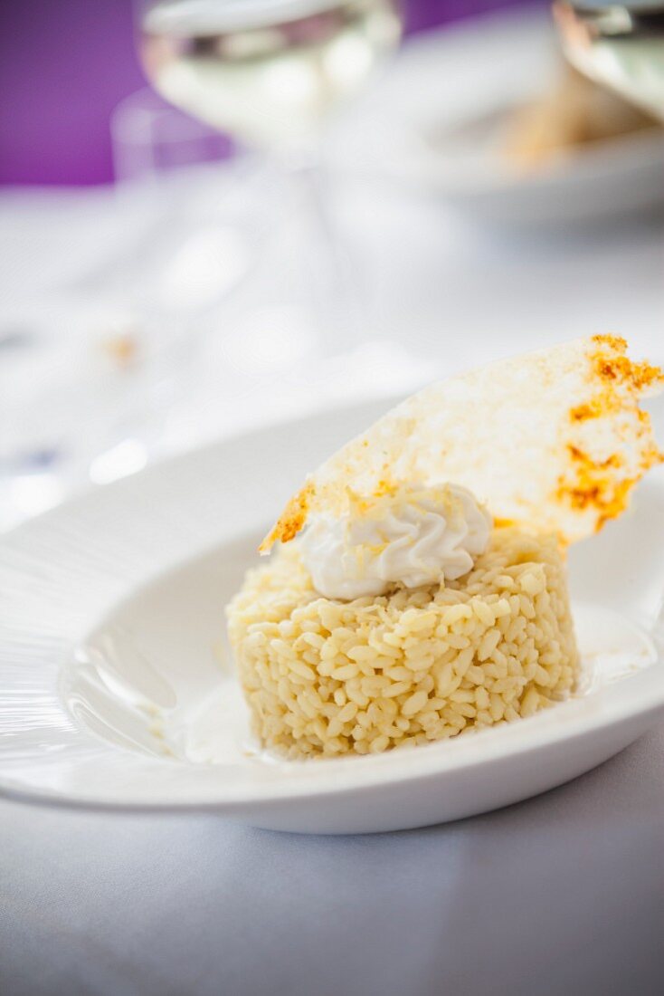 Saffron rice with Parmesan cream and Parmesan crisps