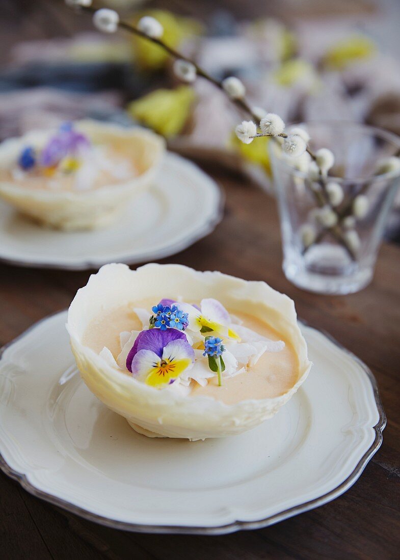 Mango mousse in chocolate bowls