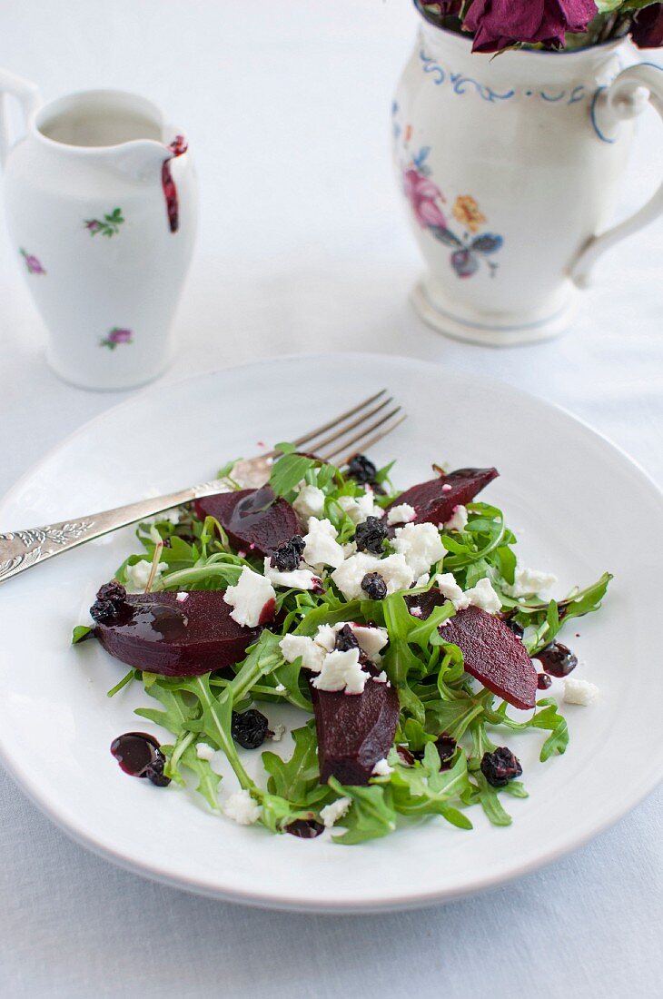 Roasted beetroot salad with rocket, feta cheese, dried blackcurrants and blackcurrant sauce