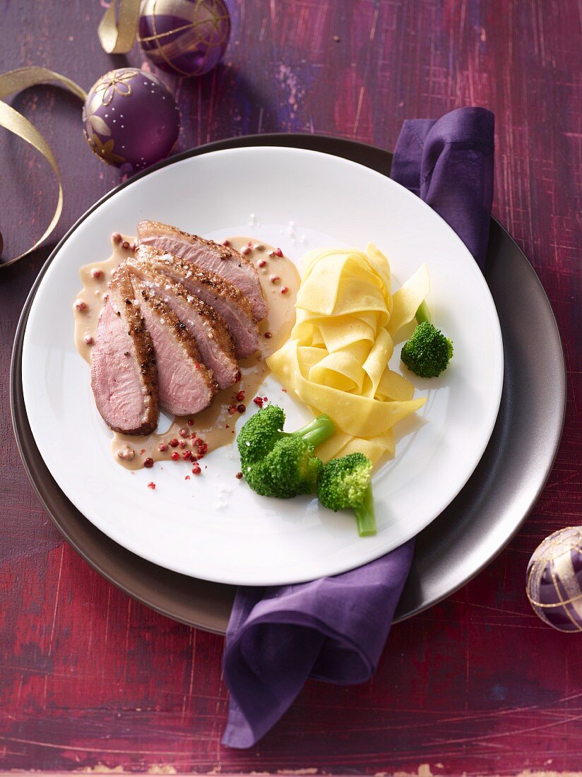 Duck breast in a pepper and cognac sauce with tagliatelle