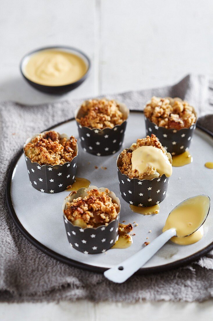 Mini apple bakes with oat and nut caramel and vanilla sauce