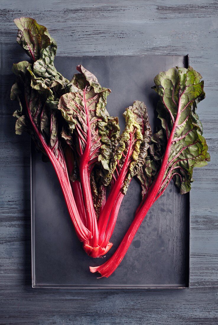Red-stemmed chard on a baking tray